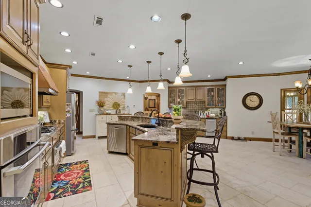 a view of a kitchen and dining room