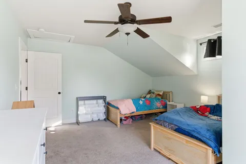 a room with toys and dresser