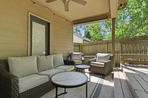 a balcony with couch and outdoor view