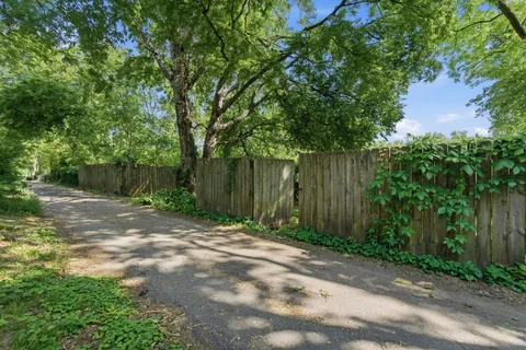 a backyard of a house with lots of green space