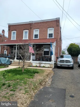 a view of a car park in front of house