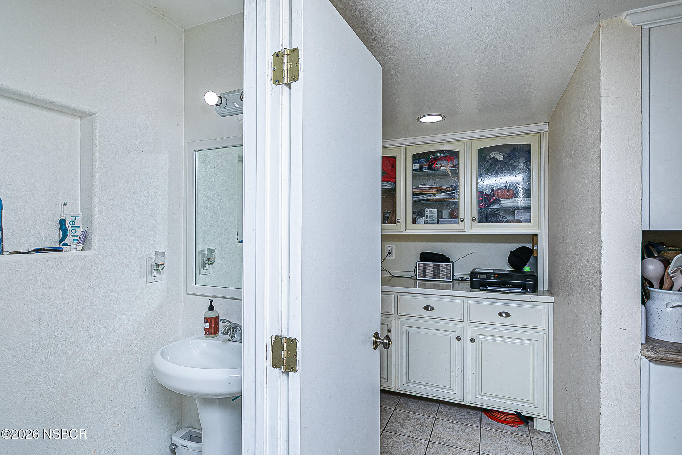 712 Pebble Beach Place Santa Maria, CA 93454 - Photo 13 of 31 a bathroom with a sink a toilet and vanity