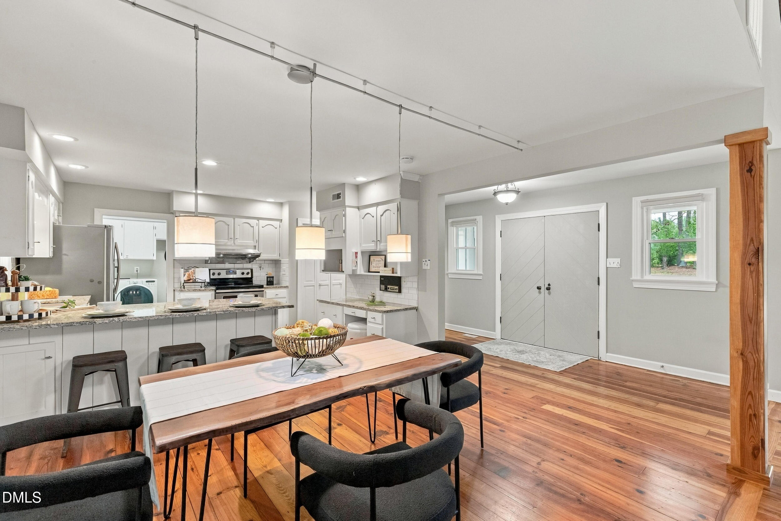 2329 Win Road Garner, NC 27529 - Photo 29 of 90 Hardwood flooring paired with a wood-finished support column