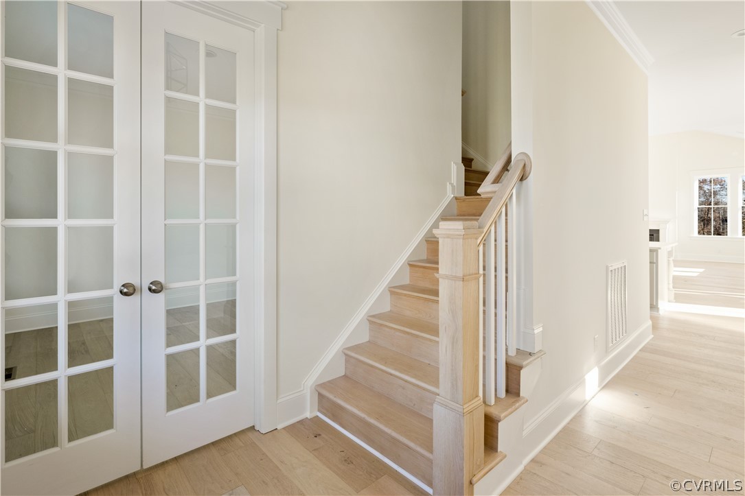 10716 River Fall Path Glen Allen, VA 23059 - Photo 2 of 7 a view of staircase with white walls and a window