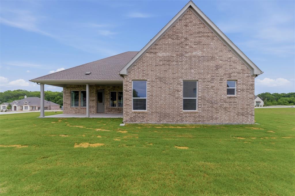 906 Perrin Lane Van Alstyne, TX 75495 - Photo 28 of 30 a view of a house with a yard porch and sitting area