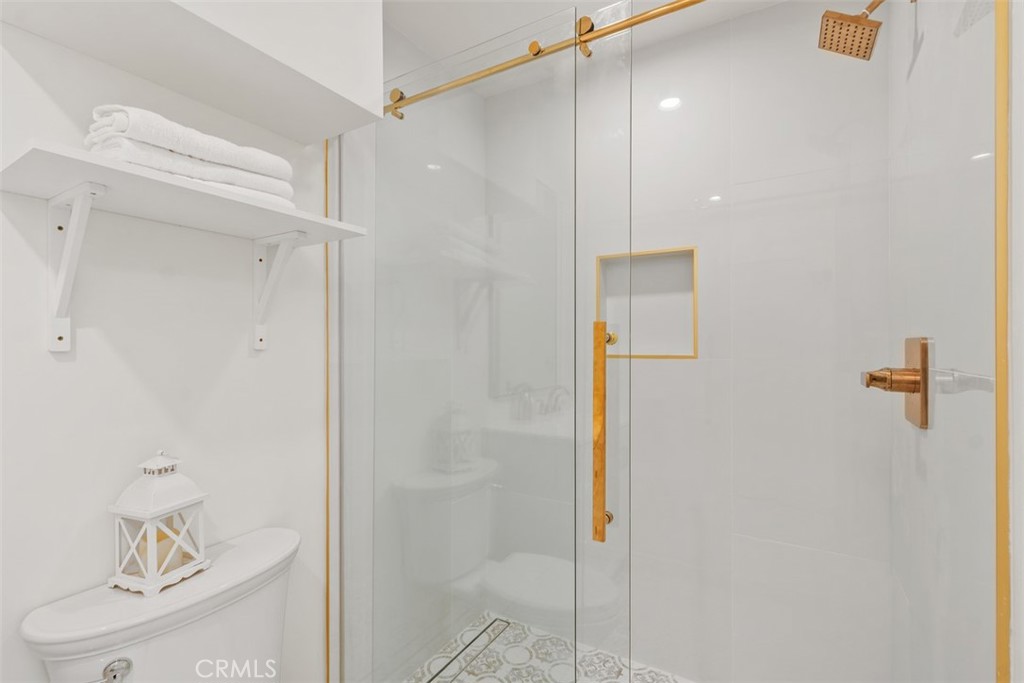 3926 Acacia Street Irvine, CA 92606 - Photo 20 of 32 a bathroom with a shower and a toilet