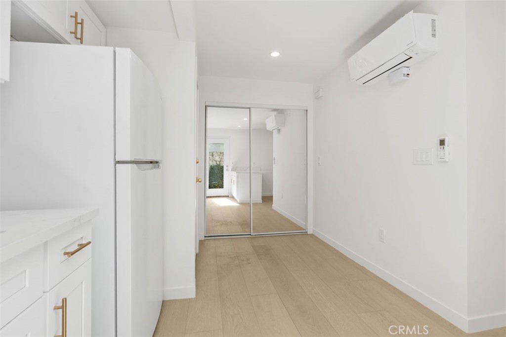 3926 Acacia Street Irvine, CA 92606 - Photo 2 of 32 a view of a hallway with a white refrigerator