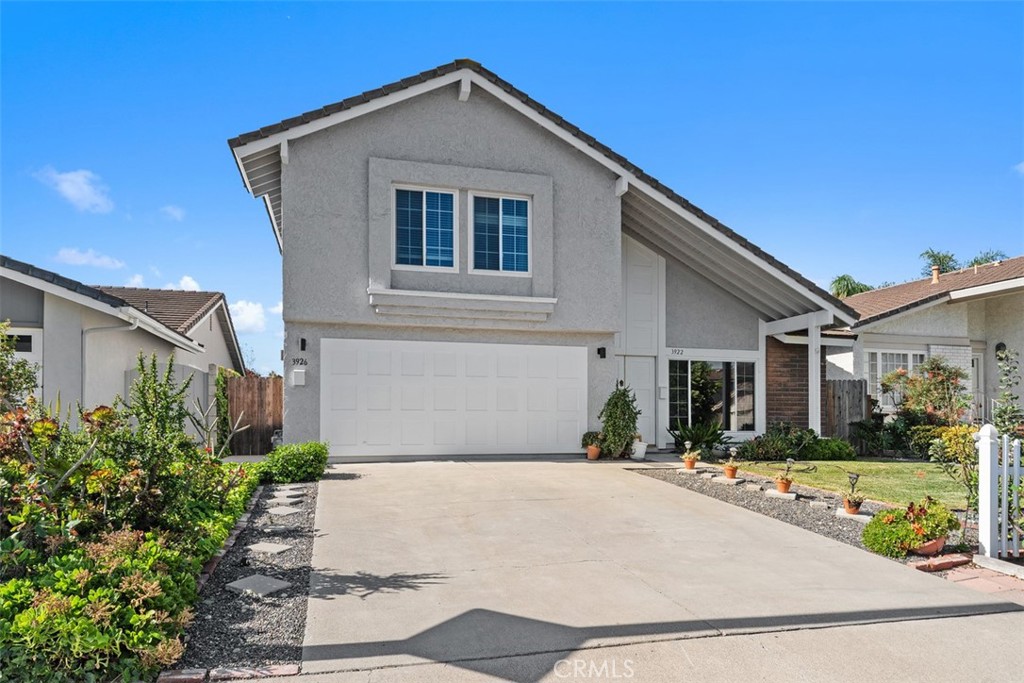 3926 Acacia Street Irvine, CA 92606 - Photo 25 of 32 a front view of a house with garden