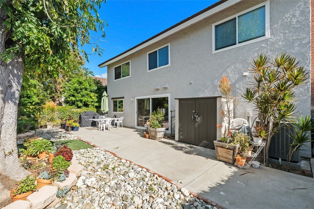 3926 Acacia Street Irvine, CA 92606 - Photo 29 of 32 a front view of a house with garden