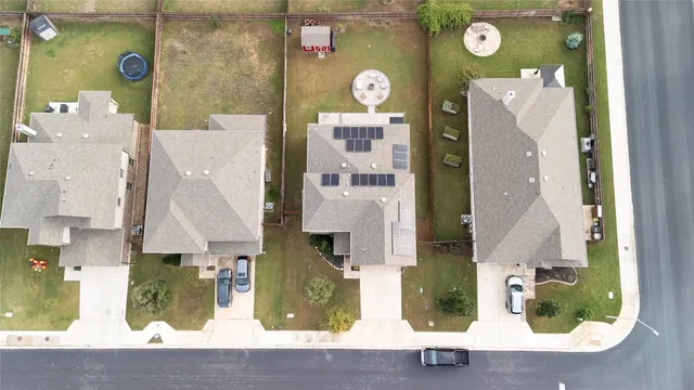 an aerial view of residential house with outdoor space