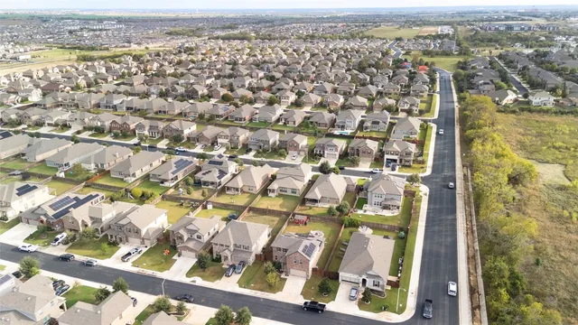 an aerial view of residential building with parking space
