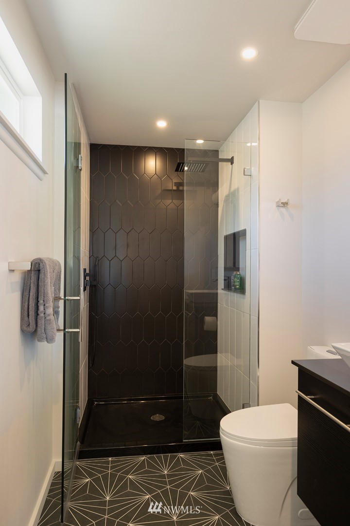 10803 Rustic Road South Seattle, WA 98178 - Photo 14 of 38 a bathroom with a shower and a toilet
