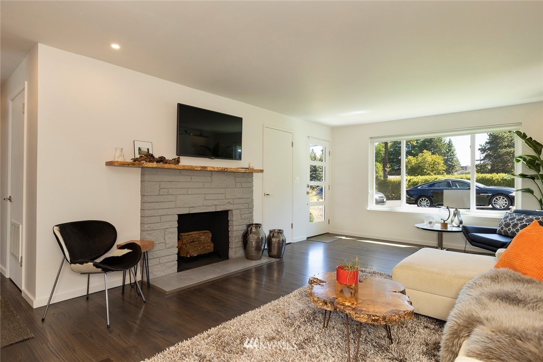 10803 Rustic Road South Seattle, WA 98178 - Photo 4 of 38 a living room with furniture fireplace and flat screen tv