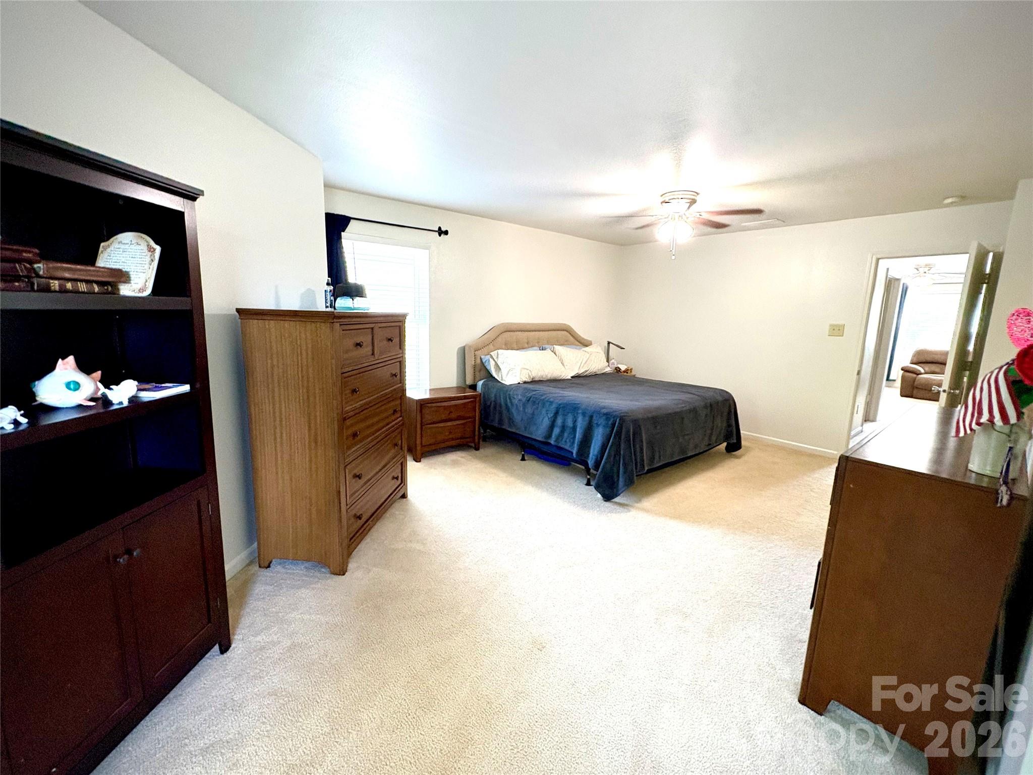2514 Spring Breeze Way Monroe, NC 28110 - Photo 15 of 25 a living room with furniture and a flat screen tv