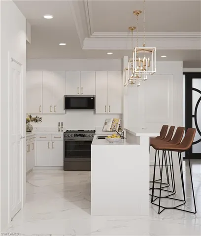 a kitchen with a stove and white cabinets