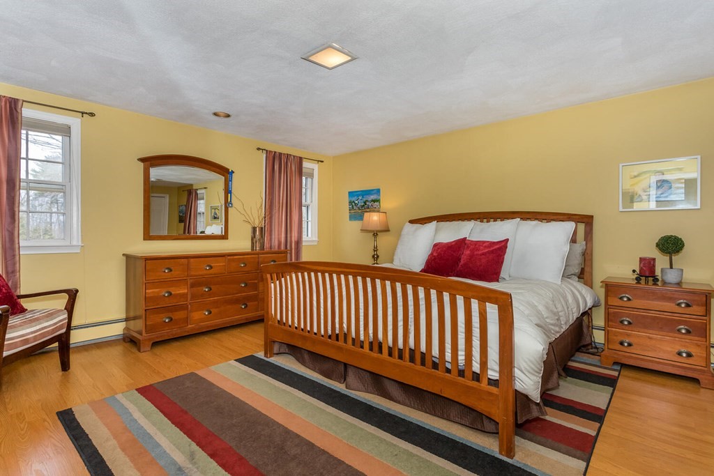14 Kings Road Canton, MA 02021 - Photo 13 of 23 a bedroom with a bed and wooden floor