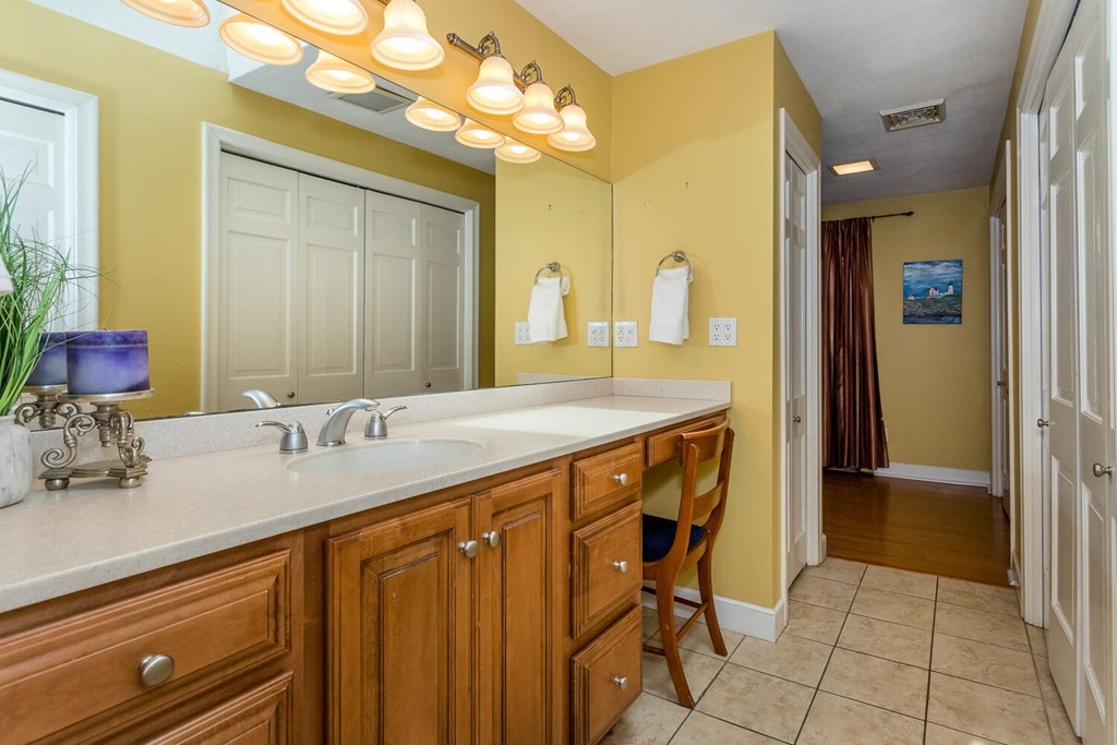14 Kings Road Canton, MA 02021 - Photo 14 of 23 a bathroom with a granite countertop sink a mirror and a shower