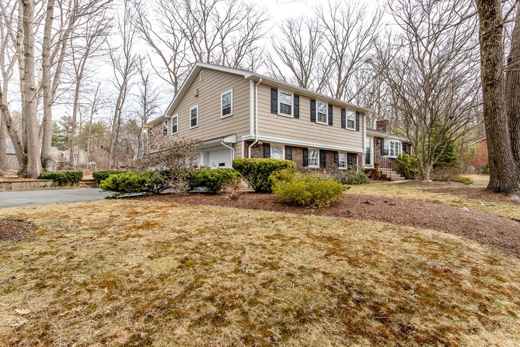 14 Kings Road Canton, MA 02021 - Photo 2 of 23 a front view of a house with a yard and outdoor seating