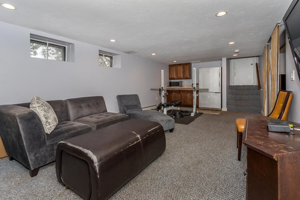 14 Kings Road Canton, MA 02021 - Photo 21 of 23 a living room with furniture and a flat screen tv