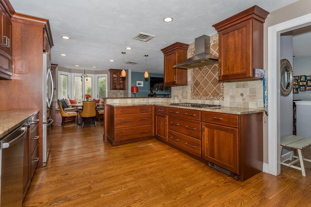 14 Kings Road Canton, MA 02021 - Photo 10 of 23 a kitchen with stainless steel appliances granite countertop a stove and cabinets