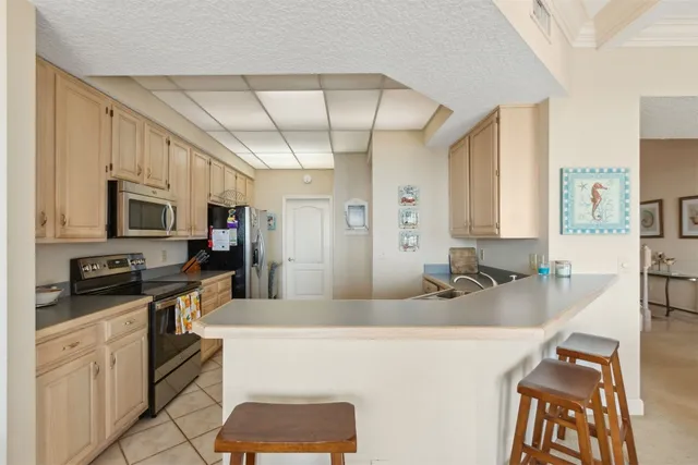 a kitchen with stainless steel appliances granite countertop a sink and cabinets