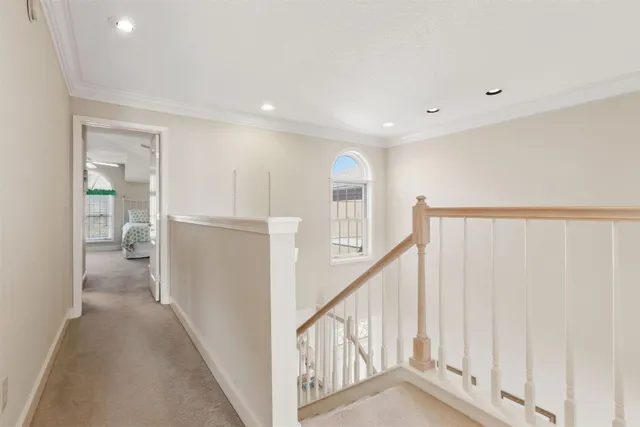 a spacious bedroom with a bed and a night stand