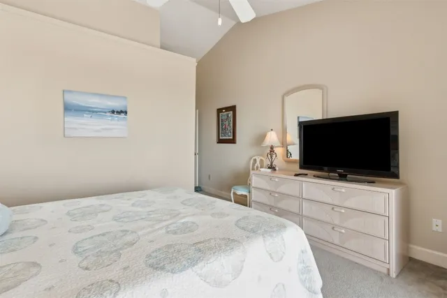 a bedroom with a bed and a lamp