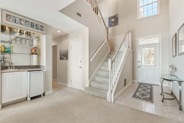 a view of an entryway with workspace and windows