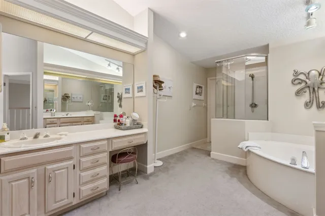 a bathroom with a bathtub and a shower