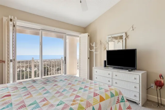 a bedroom with a bed and a table