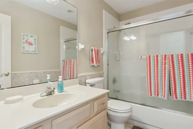 a bedroom with a bed and a chair