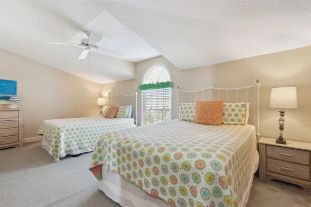 a bedroom with a bed and a flat screen tv in it