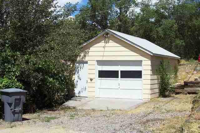 344 East 7th Street Rifle, CO 81650 - Photo 3 of 3 a front view of a house with a yard