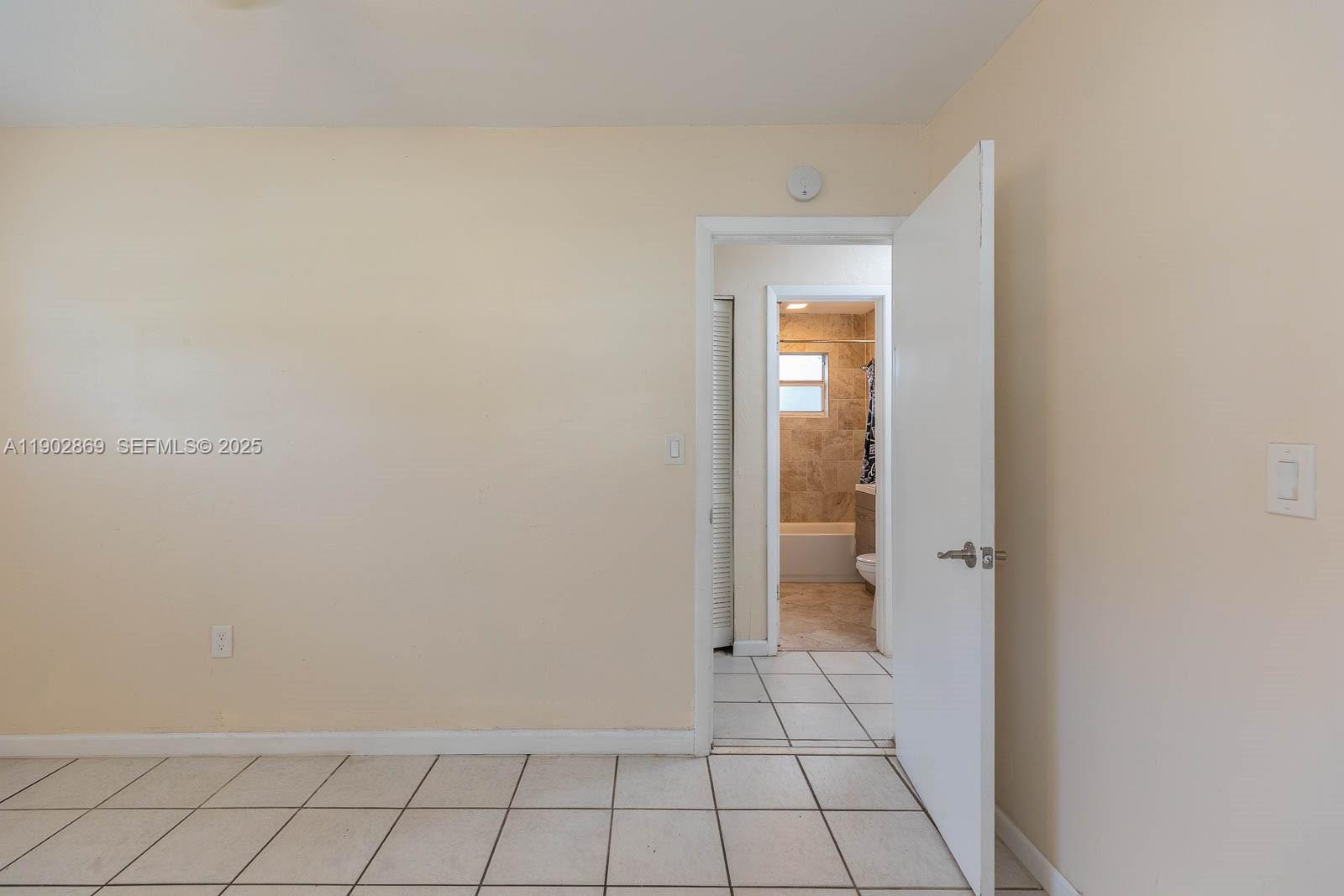 1010 North 69th Way Hollywood, FL 33024 - Photo 17 of 23 a view of an empty room and window