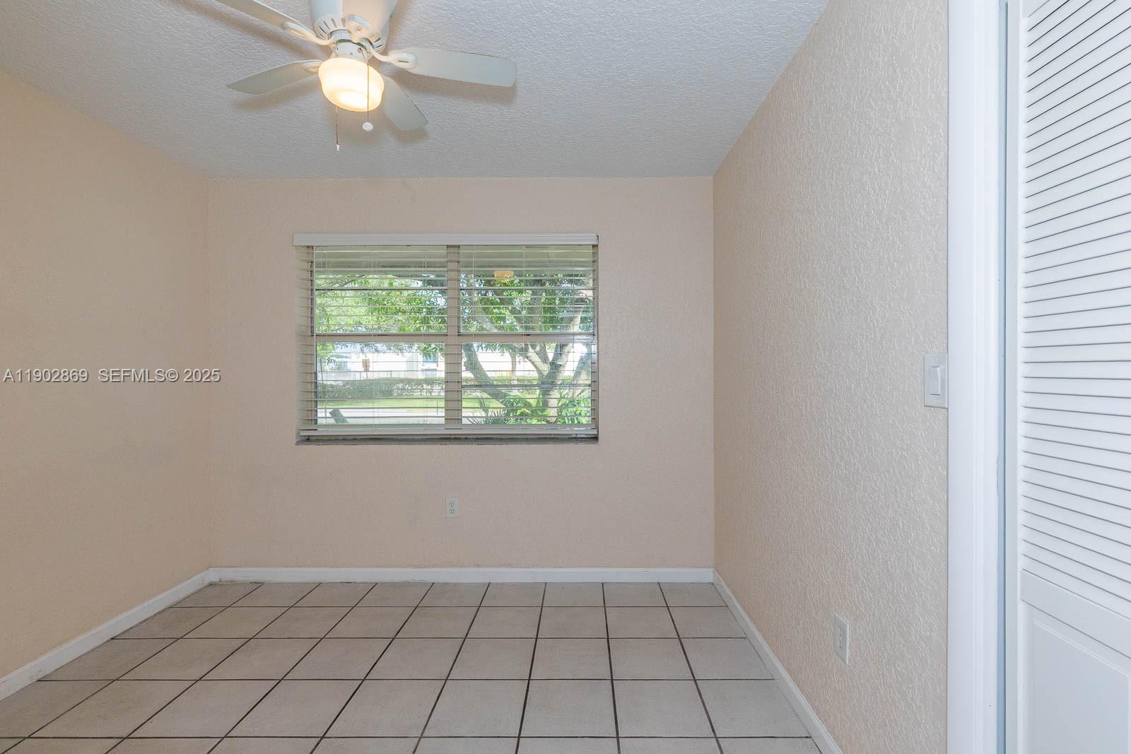 1010 North 69th Way Hollywood, FL 33024 - Photo 9 of 23 an empty room with a window