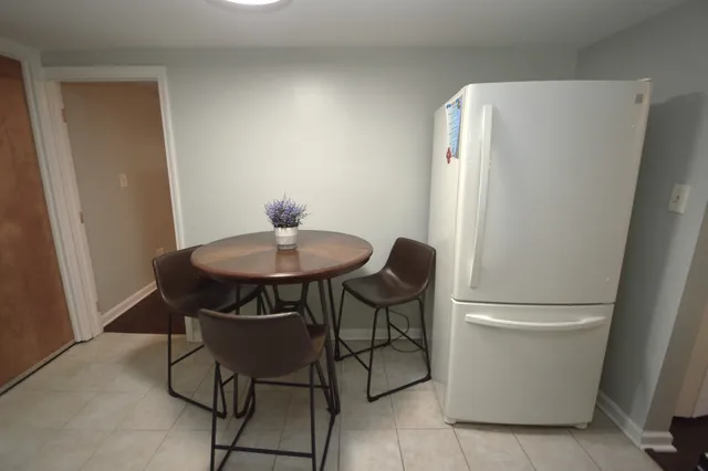 a view of dining room and hallway with furniture