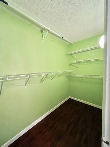 a view of a room with racks on the wall