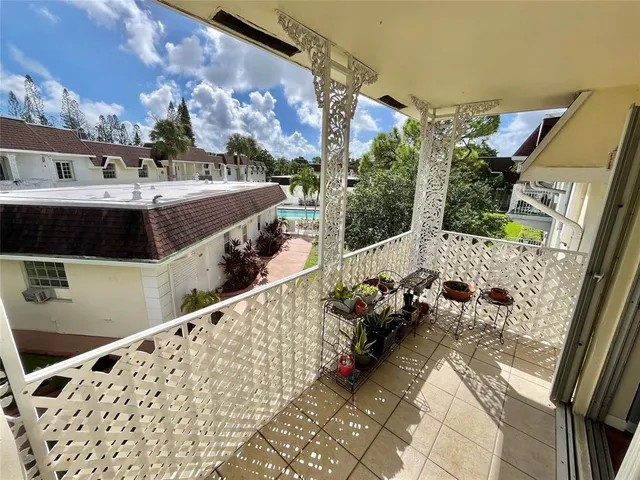 a view of balcony with furniture
