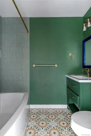 a bathroom with a sink toilet and vanity
