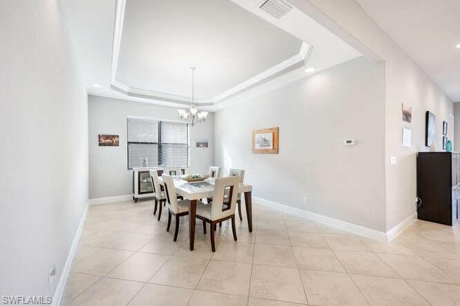 1641 Serrano Circle Naples, FL 34105 - Photo 16 of 50 a dining room with furniture and window