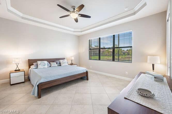 1641 Serrano Circle Naples, FL 34105 - Photo 22 of 50 a bedroom with a bed and a window