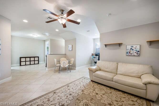 1641 Serrano Circle Naples, FL 34105 - Photo 31 of 50 a living room with furniture and white walls