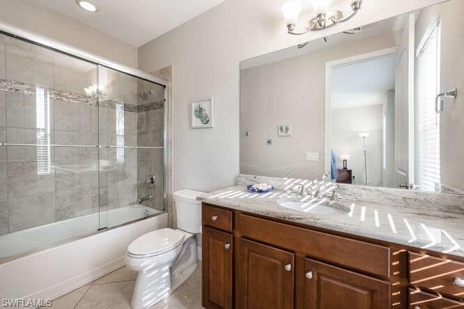1641 Serrano Circle Naples, FL 34105 - Photo 38 of 50 a bathroom with a sink a toilet and shower