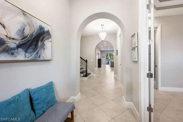 a living room with furniture and a painting