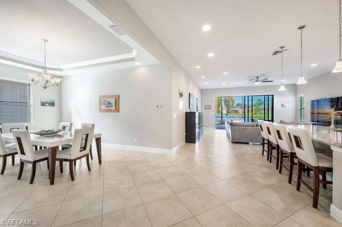 1641 Serrano Circle Naples, FL 34105 - Photo 6 of 50 a view of a dining area with furniture