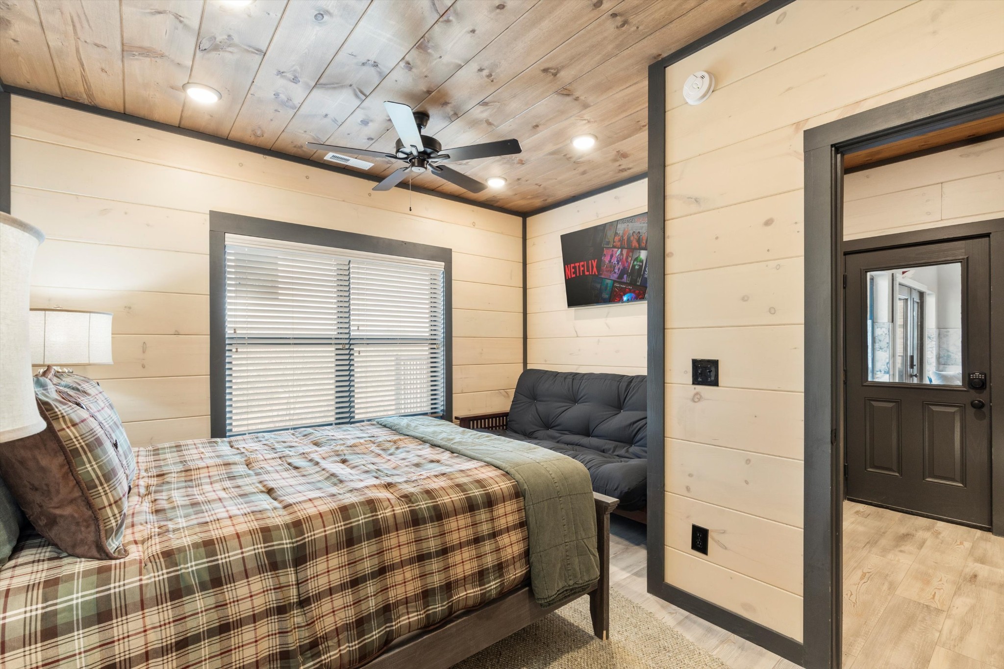 60 R Rambling Crk Way Sevierville, TN 37862 - Photo 40 of 49 a bedroom with a large bed and a large window