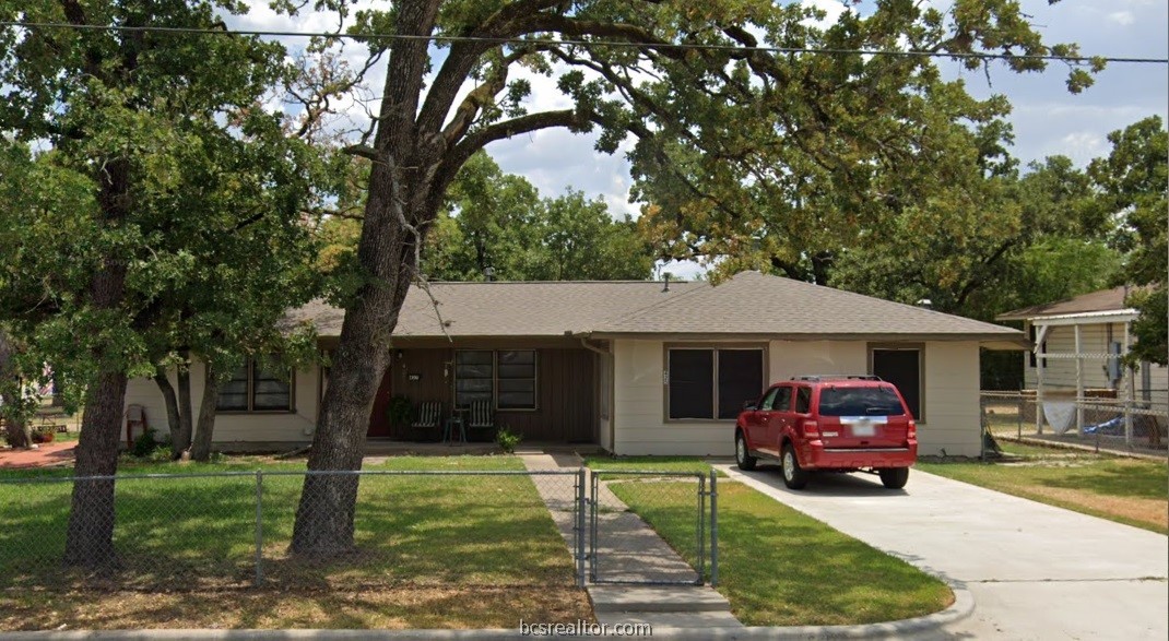 403 Sulphur Springs Road Bryan, TX 77801 - Photo 7 of 7 a front view of a house with garden
