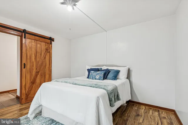a view of a livingroom with furniture and staircase