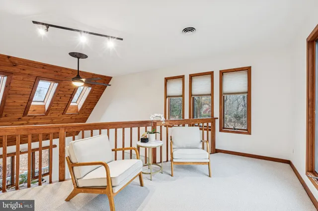 a bedroom with a bed and ceiling fan