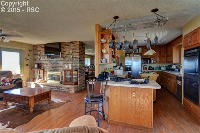 23799 Sanborn Road Calhan, CO 80808 - Photo 3 of 15 Kitchen opens into Living Room